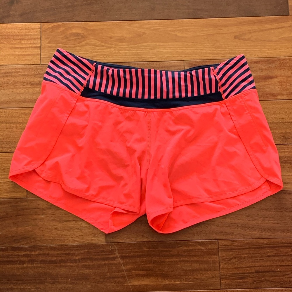 Bright pink Lululemon running shorts
